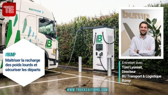 Camion électrique raccordé à une borne de recharge Bump sur un site logistique - Entretien Tom Lyonnet Truckeditions